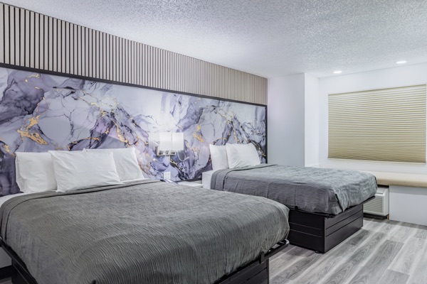Remodeled room with two queen beds