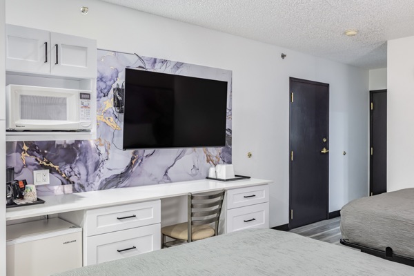 Two queen room television wall