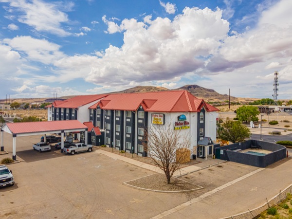 Western Skies Inn & Suites and surrounding landscape